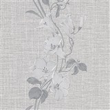 Vliesové tapety na stenu IMPOL HIT kvety na sivom textilnom podklade so strieborným prešívaním